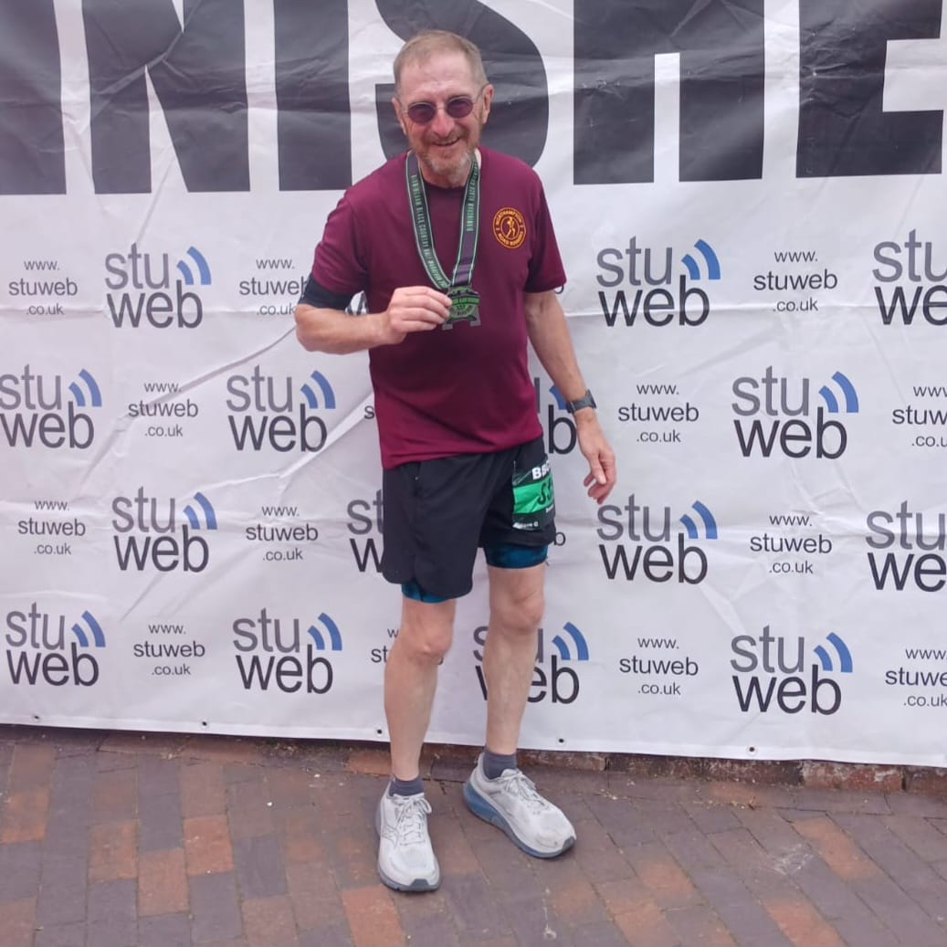 NRR masters runner in club colours